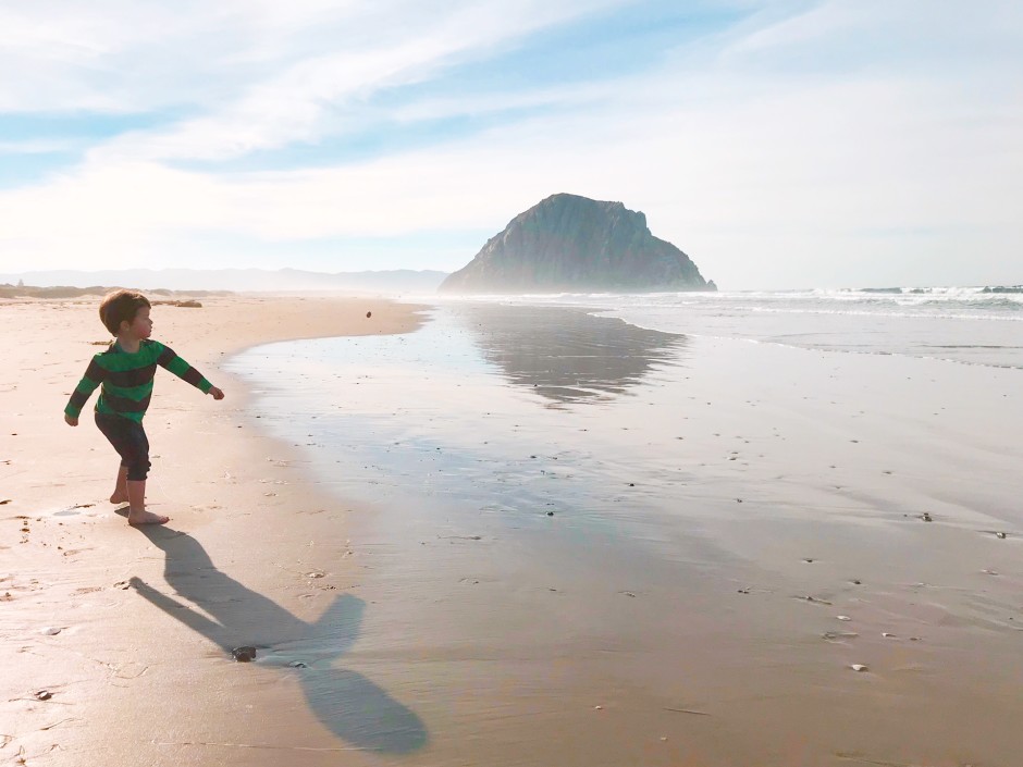 The world's cutest toddler, running along a beach